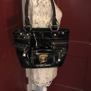 Kathy Van Zeeland Black handbag with gold trim