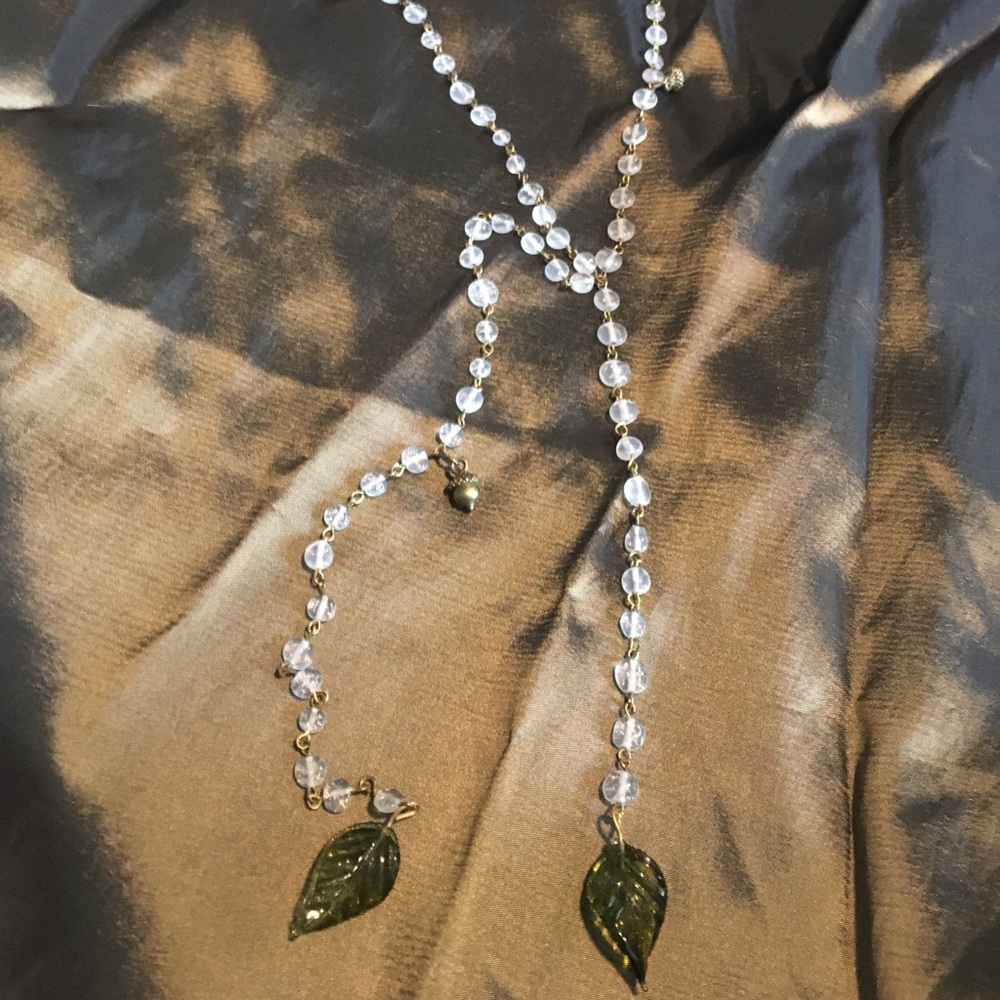 “Rosary”style beaded lariat necklace with charms.