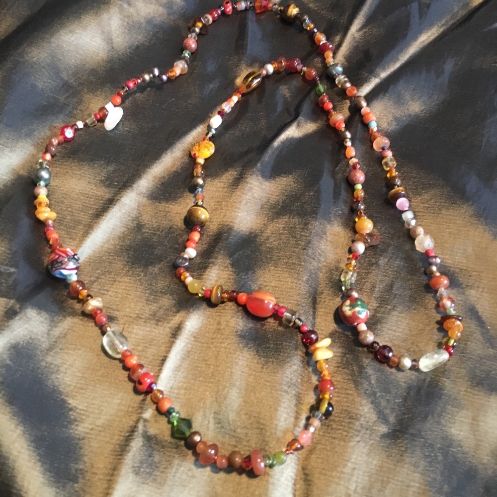 Long hand-strung beaded necklace.
