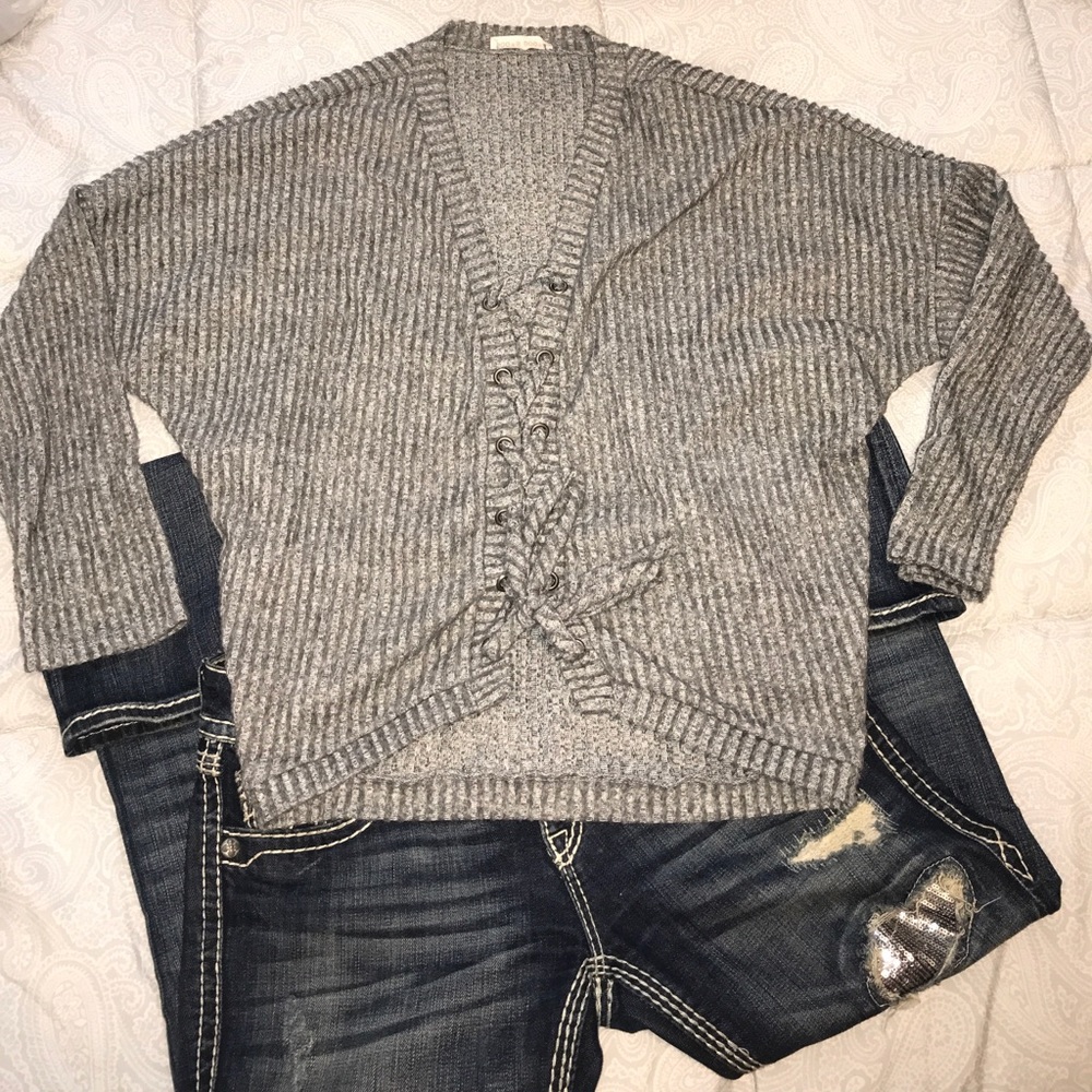 Cute long sleeve with a lace down in the middle!