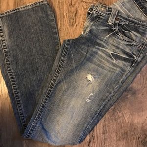 Distressed women's jeans