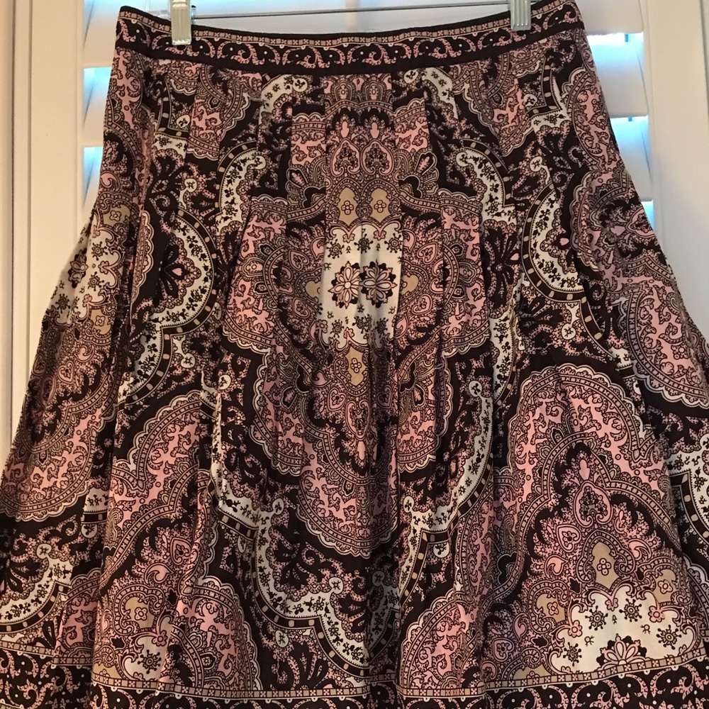 Pleated skirt with dark tans and pink.