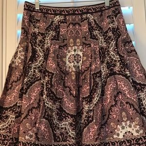 Pleated skirt with dark tans and pink.