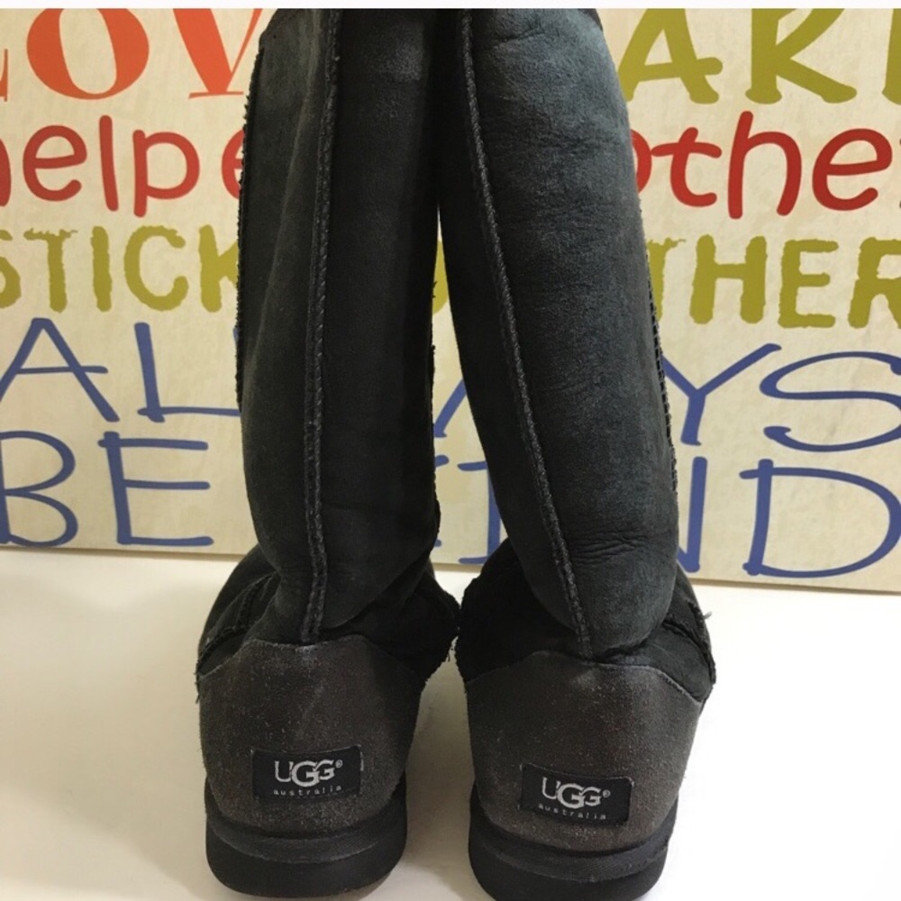 Tall black UGG boots