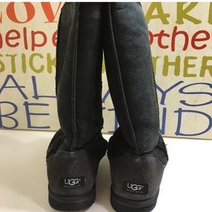 Tall black UGG boots
