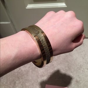 Burberry bracelet in gold/brass color.
