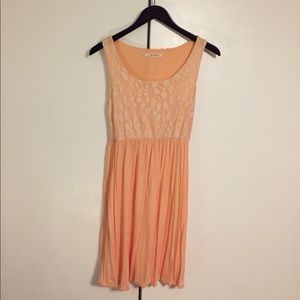 Peach colored dress with lace top overlay