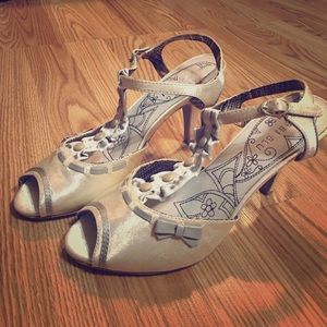 White and Grey ankle strap heels.