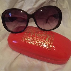 Purple Coach Poppy sunglasses with case