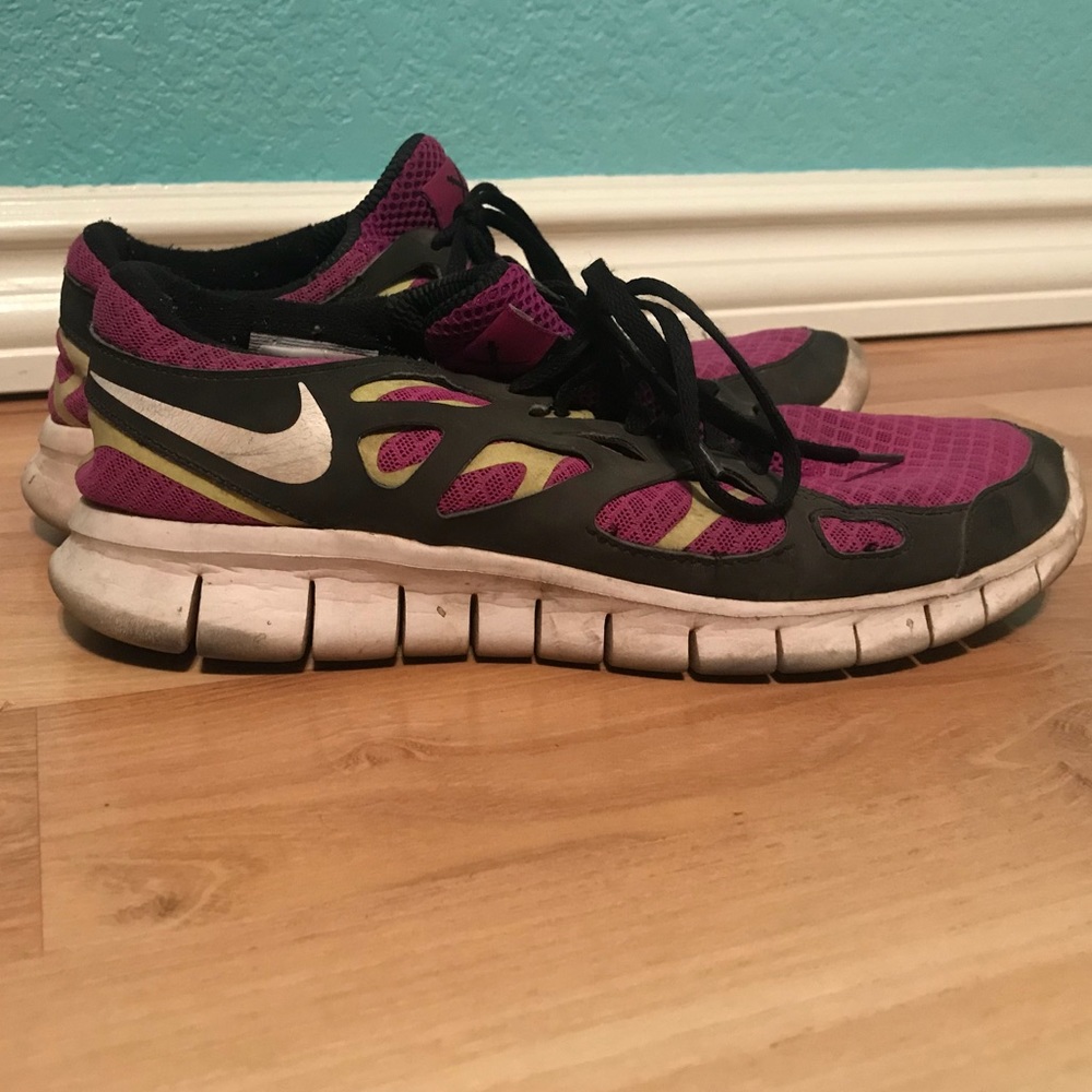 Purple and green Nike free runs