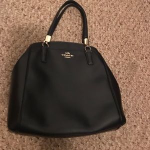 Well loved navy coach with brand new should strap.