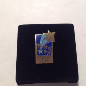 NIB Above and Beyond pin. In box