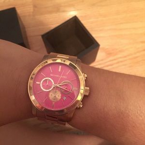 Rose gold Michael Kors watch with pink face
