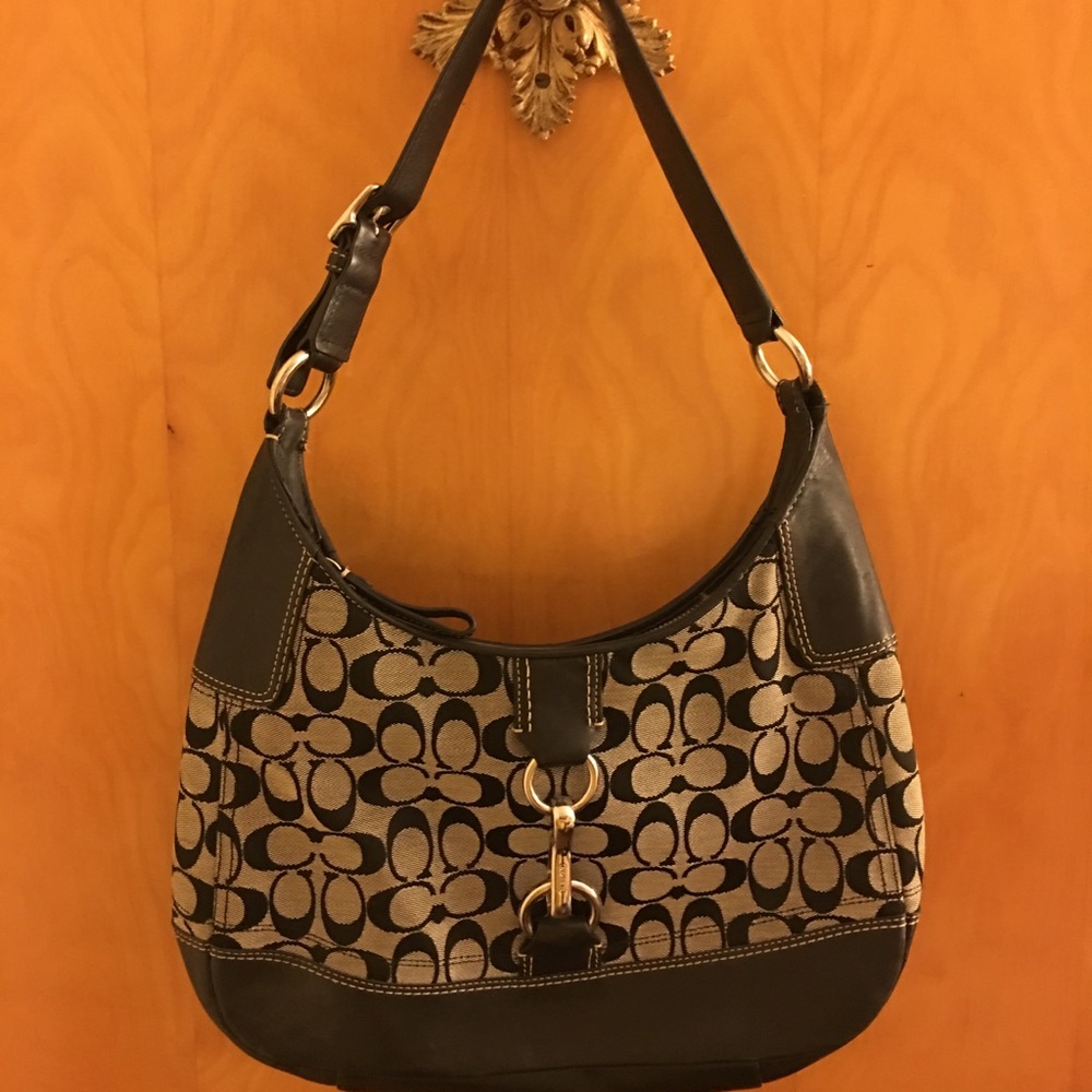 Black and gray Coach pocket book