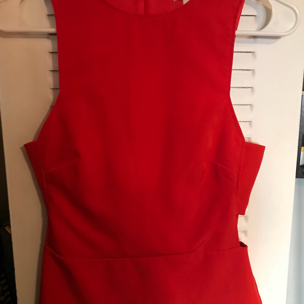 Orange top with cut out on the sides