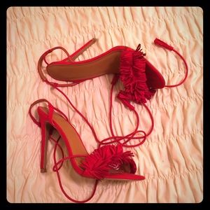 Red tassel heels