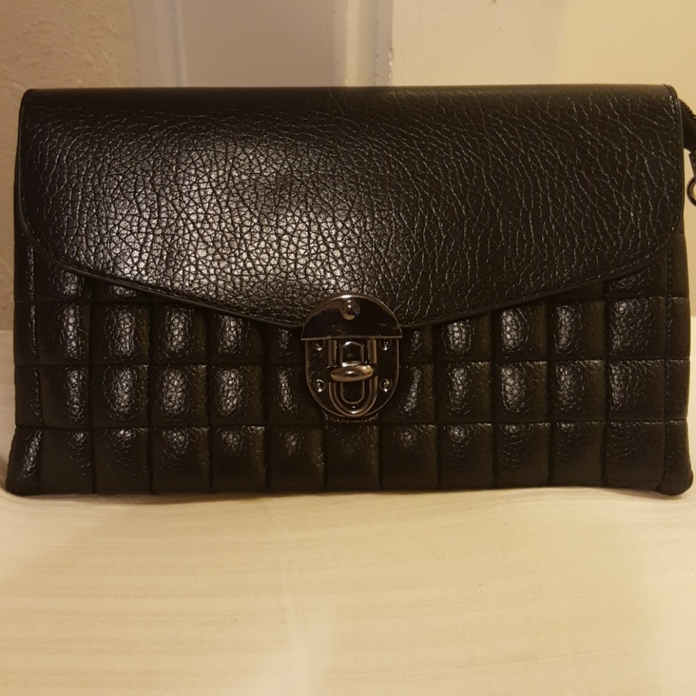 Black clutch with shoulder and wrist strap.