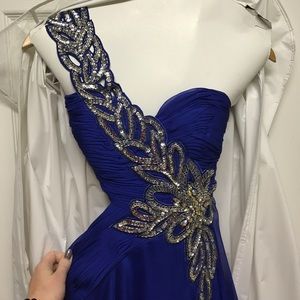 Long deep blue prom dress with cutouts and jewels