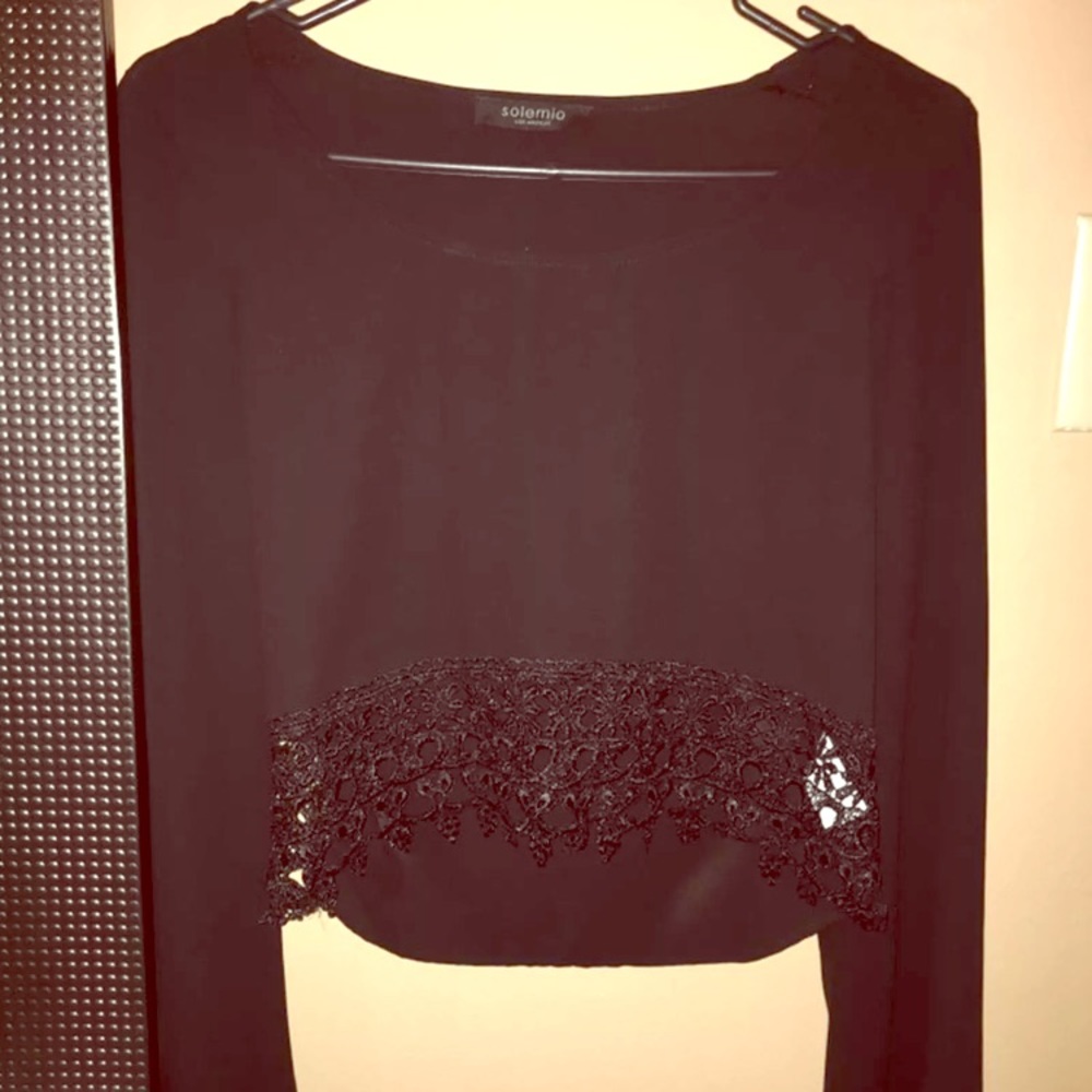 Bell sleeved black top