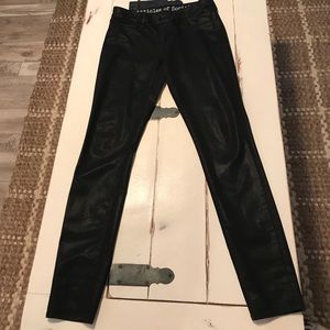 Black wax coated skinny jeans