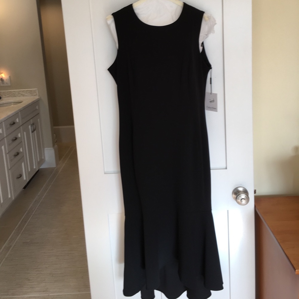 Black sheath with mermaid high low ruffle.