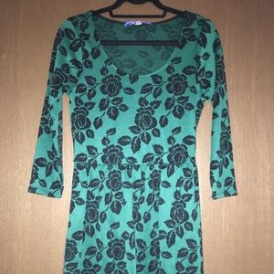 Francesca’s green patterned dress