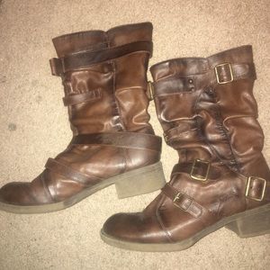 Brown combat boots with gold hardware