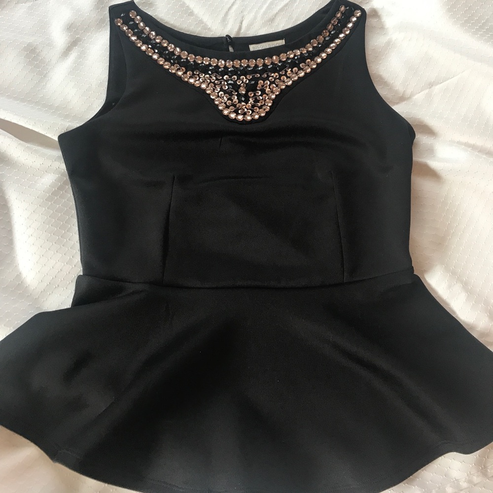 Flattering and elegant shirt with beaded neckline
