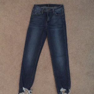 Jeans with ripped bottom