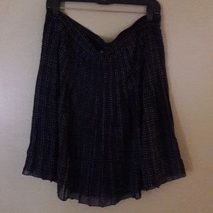 Knee length, flowing skirt.