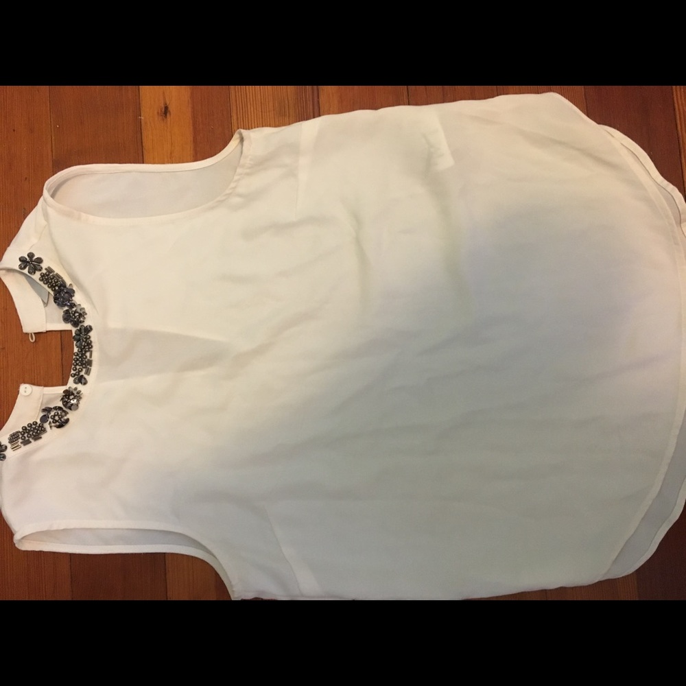 White top with a jeweled neckline