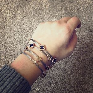 4 black gold and silver stackable bracelets