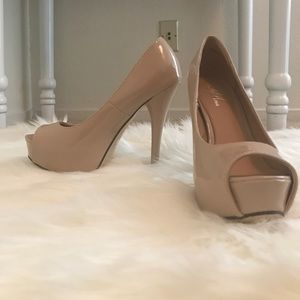 Beige open toe pumps