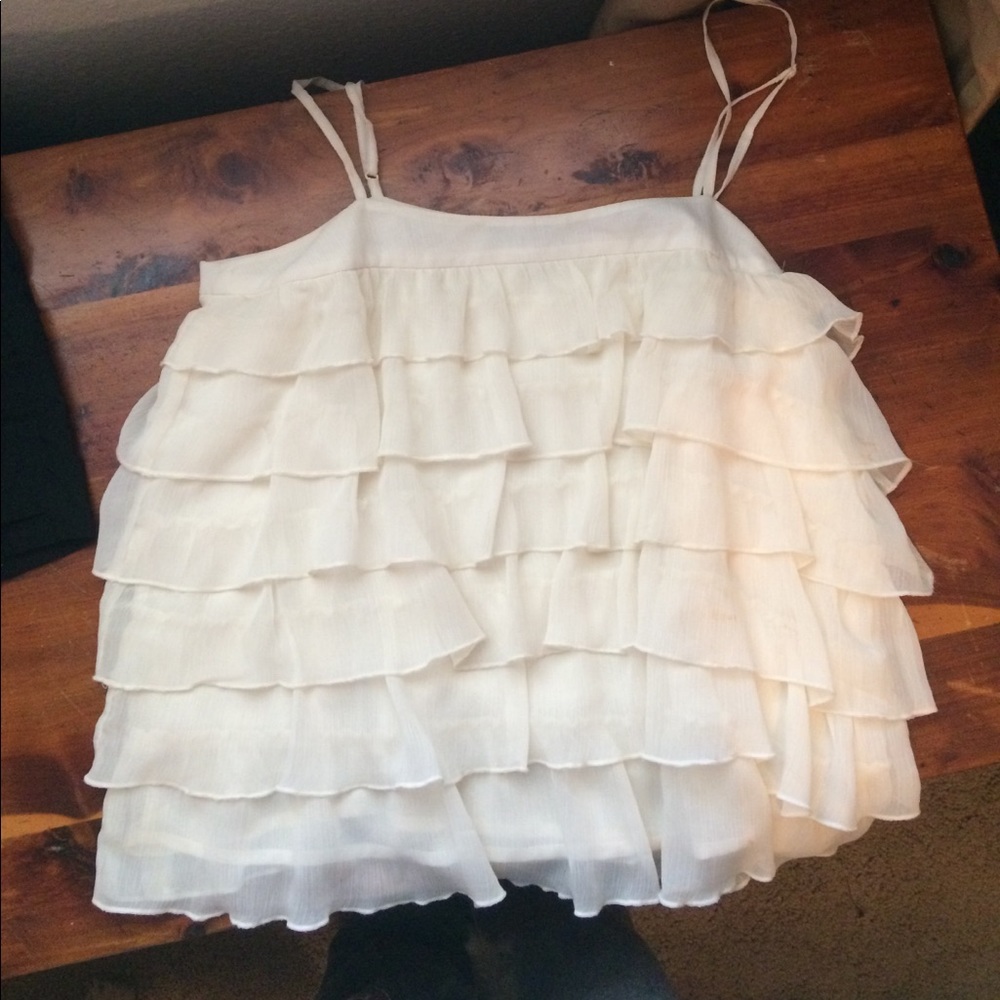 Women's cream colored flowy ruffled top
