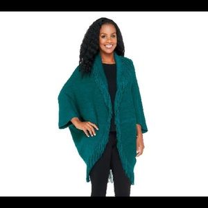 Marvelush shrug with fringe and cable detail.