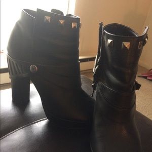 Black side zip up ankle booties.