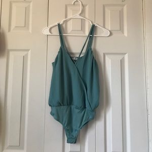 Crisscross strap body suit