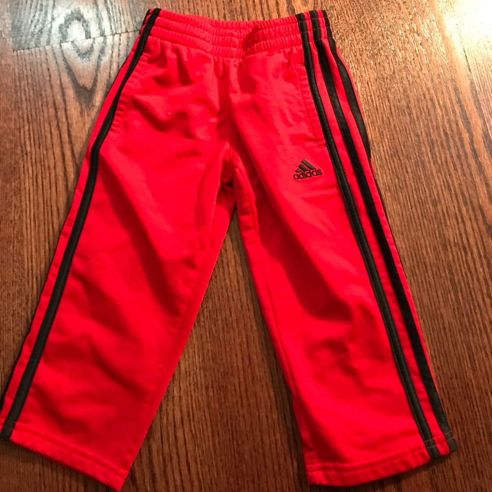 Red adidas track pants