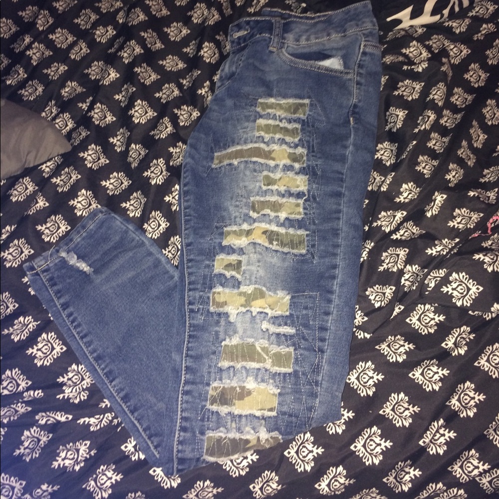Ripped camp blue jeans