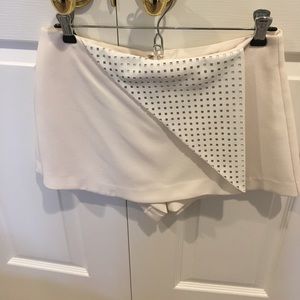 BCBG cream skort with leather front flap size 4
