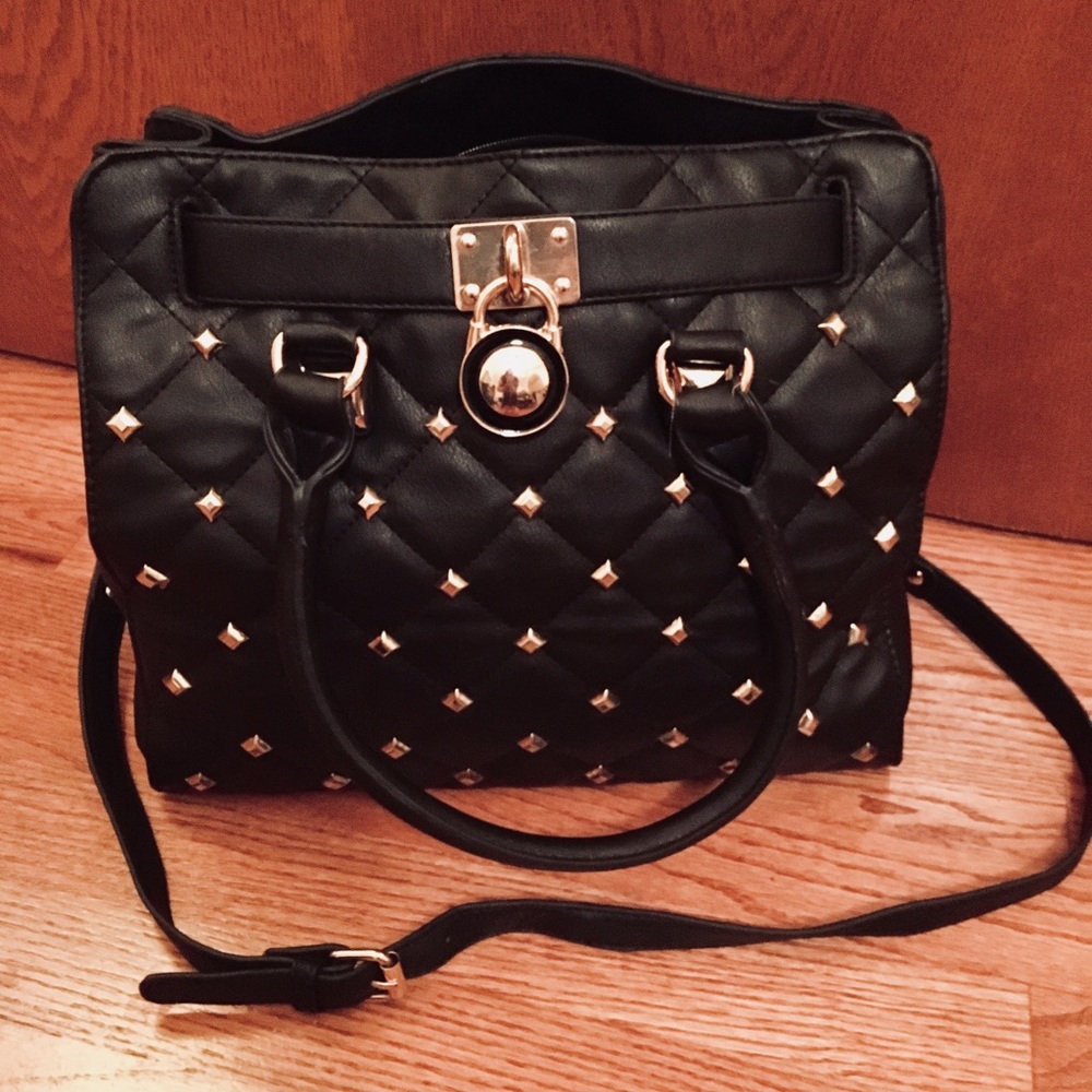 Black purse with gold accents.
