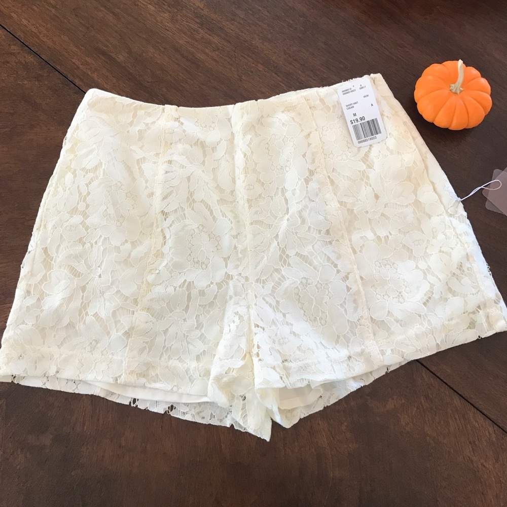 Cream lace over shorts