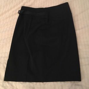 Express pencil skirt with attached metal belt.