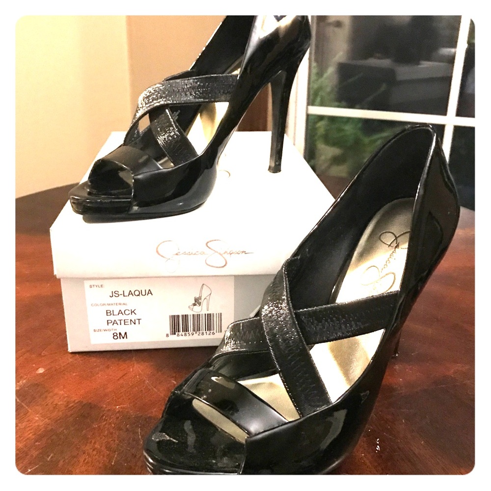Black Jessica Simpson peep toe stiletto. Size 8