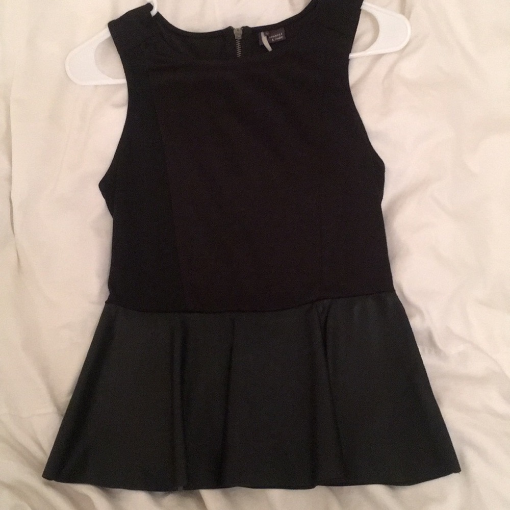 Black peplum top with leather at the bottom