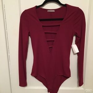 Burgundy deep plunge bodysuit.