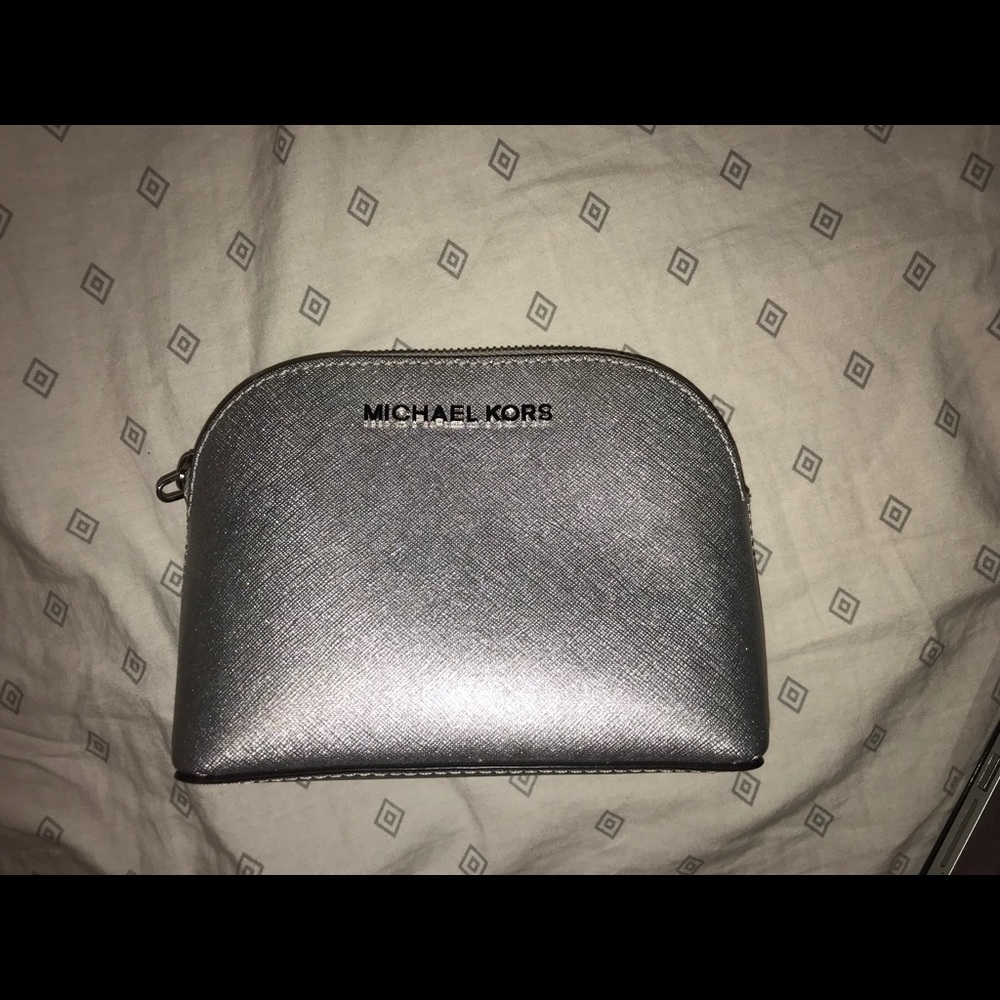 Metallic silver Michael Kors make up bag
