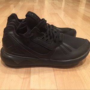 Solid black adidas tubulars