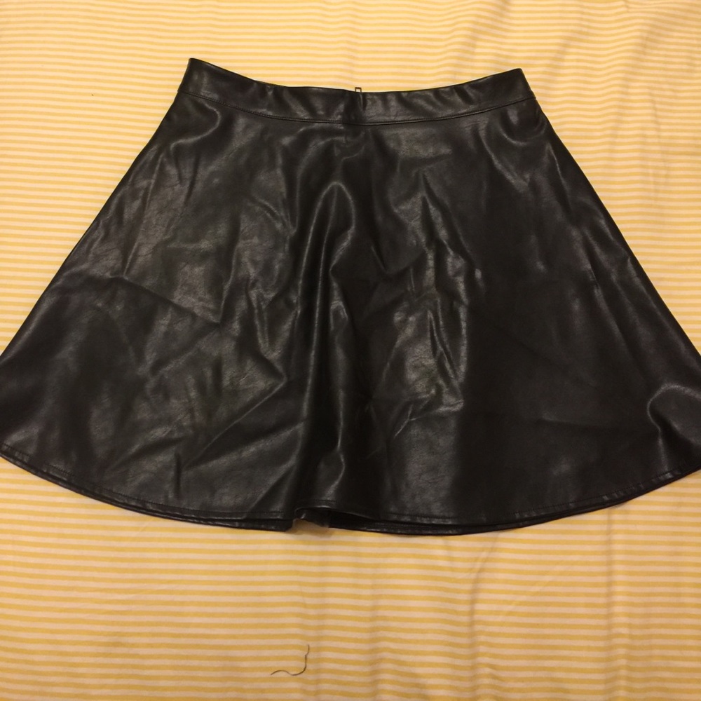 Leather-like skirt.