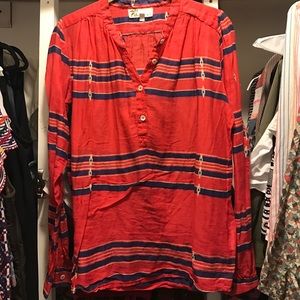 red, blue, and gold striped shirt